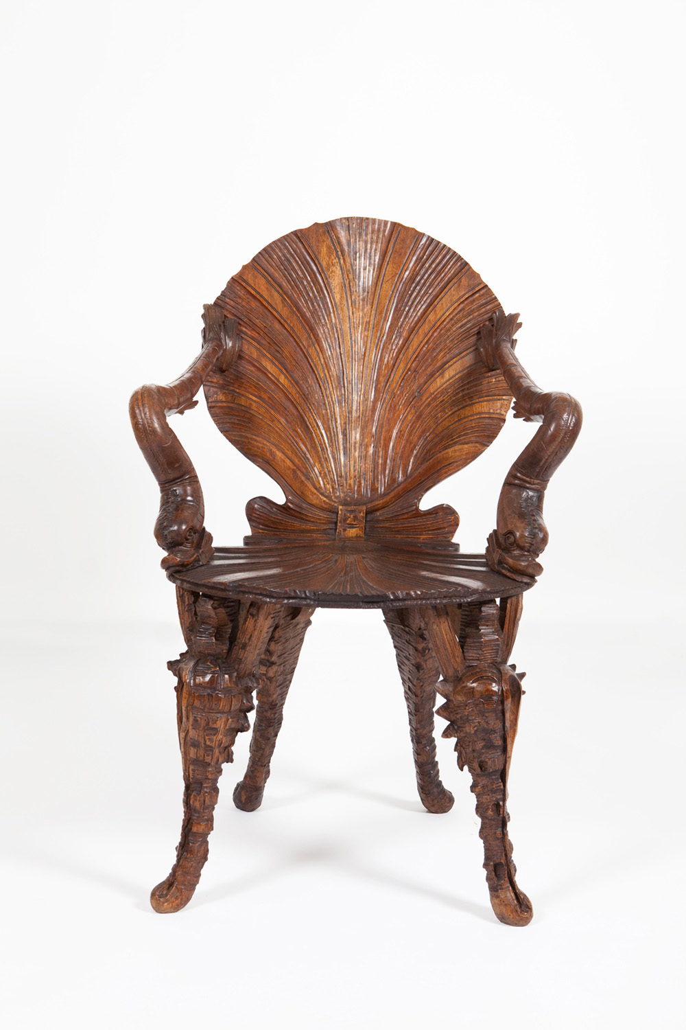 A Venetian Grotto chair hand-carved in walnut wood. Purchased in Italy by John Macmillan Brown c.1900.